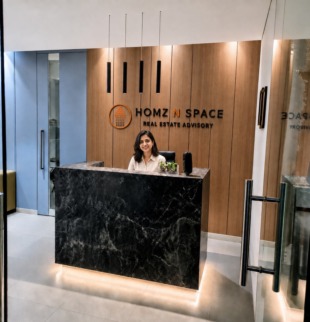 Homz N Space reception area with a receptionist seated behind the desk