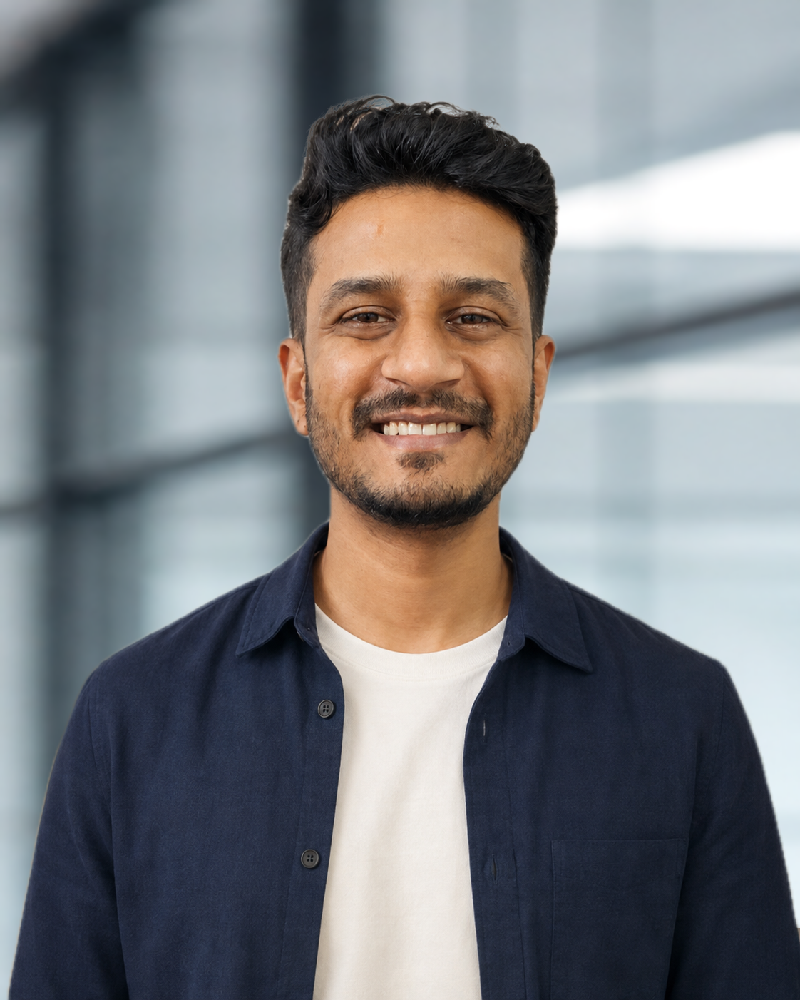 Prajwal Prasad in a navy overshirt and light crew-neck T-shirt